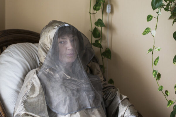 September 15th, 2017, Vigevano, Italy.
“Every night I feel my body trembling. My abdom starts paining and stiffening. Sometimes I’m forced to wrap myself with a blanket made of silver and copper, to protect myself  from the electric shocks that cross my body.”
Erika, 53 years old, in her house in Vigevano wearing her electromagnetic shielding clothes that she uses to go out.