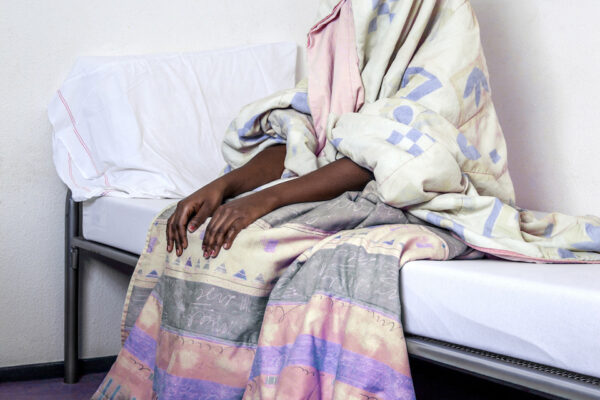 “When I was a young girl, I was entered into an arranged marriage. I also ended up having children with this man. When he found out I was lesbian, he didn’t want any-thing to do with me and my kids anymore. I was a midwife and ran my own practice, but no men would let their wives come to my clinic anymore. I had been in contact with a group of people who understood me for a while, when one day this conspicuous woman turned up. She turned out to be Dutch and promised me a nice future in the Netherlands. Both my mother and I had doubts as to her intentions, but I went with her nonetheless. I did have to pay a lot of money for my trip to the Netherlands; money I had to borrow from other relatives.
After a terribly long journey through Europe I finally arrived at a small apartment in the Netherlands. After a couple of hours’ sleep the cheery lady woke me up. She told me I would need to pay her for lodgings. Because I had no money left, I had to work for her. After weeks of being locked in a room having to entertain various men, I fled. I didn’t know where to go, until someone took me to police.
My children are in my mother’s care. She doesn’t know anything yet about what hap-pened. I am afraid to tell her. Once I’ve settled down and know what to do next, I will try to tell her. The shame I feel is too immense and being away from my children hurts.”